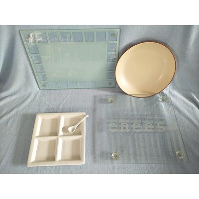 Assorted serving dishes and chopping board