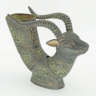 Chinese Bronze Patinated Cast Metal Archaistic Style Goat Form Rhyton 20th Century, Now Drilled and Converted to a Lamp Base