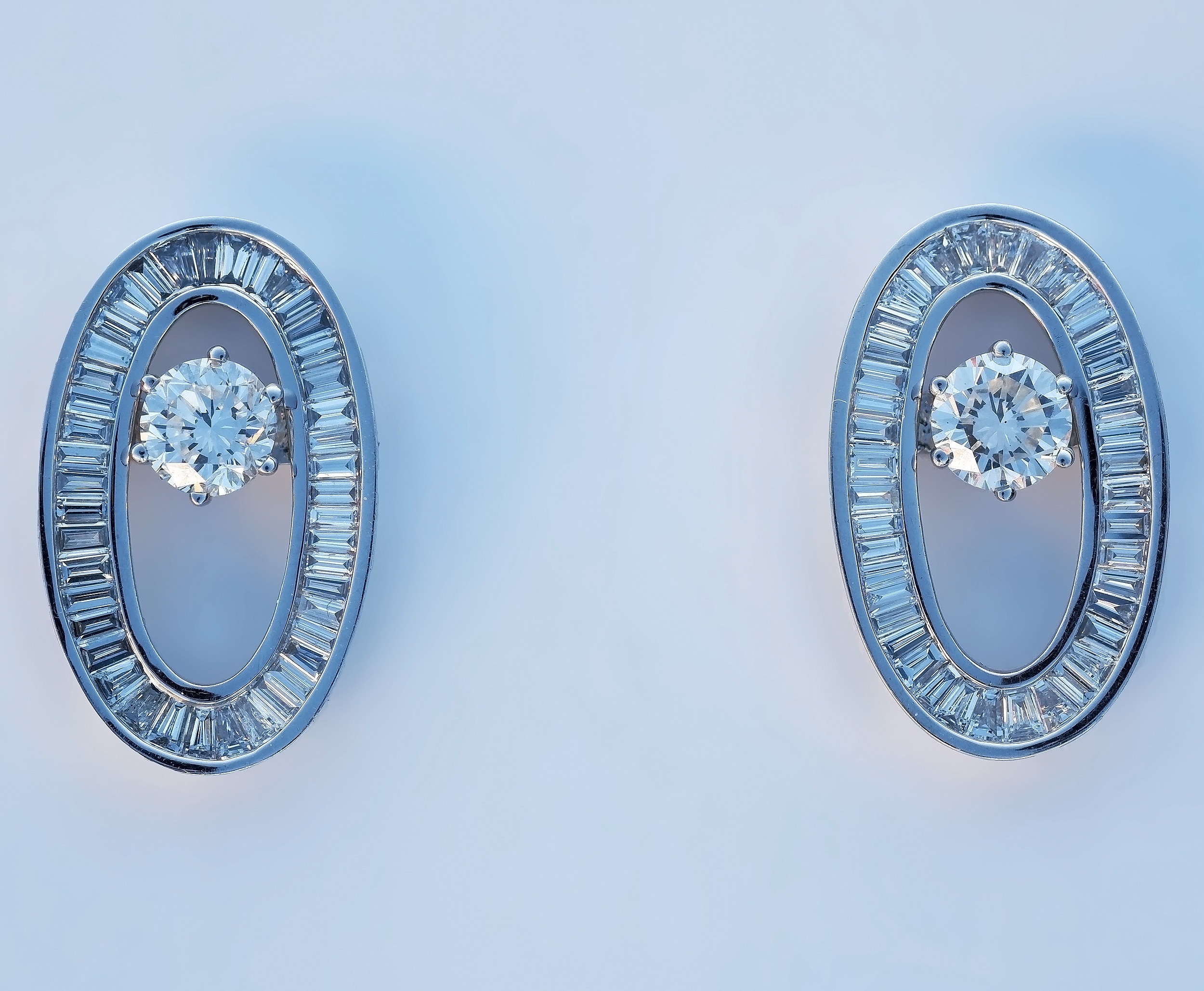 'A Superb Pair of 18ct White Gold Diamond Stud Earrings with Removable Oval Frame of Baguette and Tapered Baguette Diamonds'
