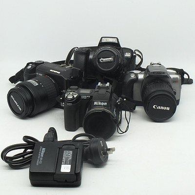 A Group of Four Various Digital and Film Cameras, Including a Canon EOS 300X, Olympus E-300 and More