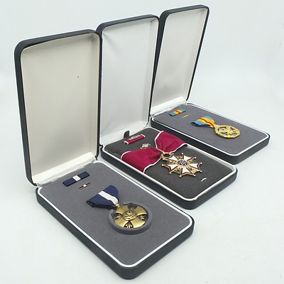 Three United States Medals, including Legion of Merit Commander, U.S. Defense DSM and U.S. Navy Cross