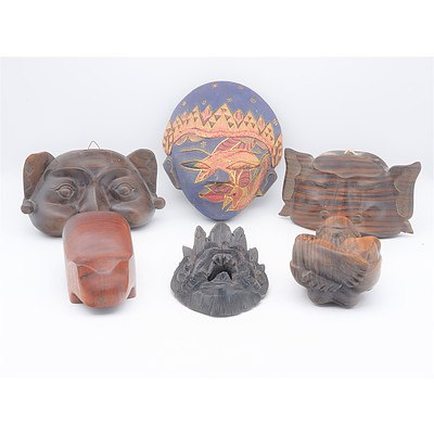 Group of South East Asian and Other Carvings Including Crying Man and Thai Mask