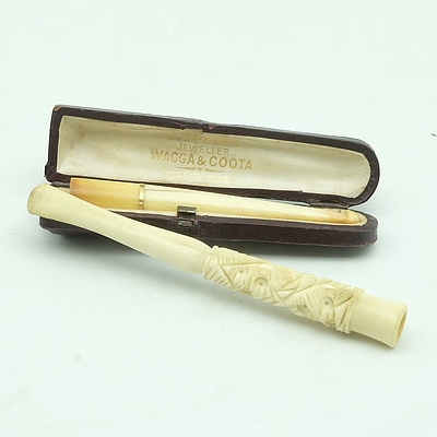 Ivory Cigarette Holder in a French Wagga and Coota Case and Another Engraved Bone Cigarette Holder