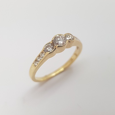 18ct Yellow Gold Diamond Ring with Flat Band Set with 3 Brilliant Cut Diamonds in Each Shoulder And 3 Brilliant Cut Diamonds Set in the Centre