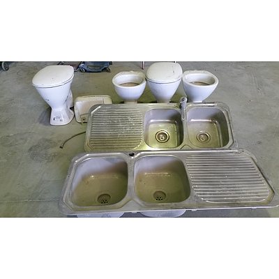 Four Ceramic Toilet Bowls and Two Stainless Steel Kitchen Sinks