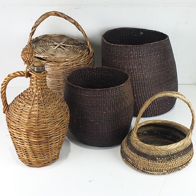 A Group of Wicker Baskets and a Glass Demijohn