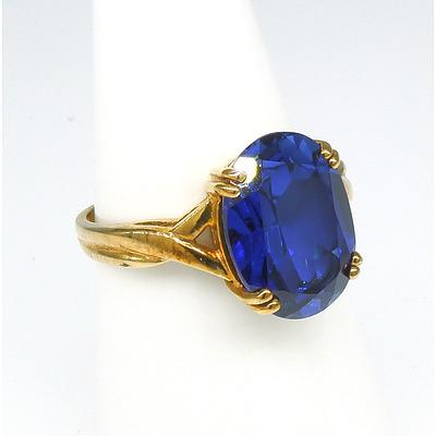 9ct Yellow Gold Ring With Oval Blue Synthetic Gem in Four Claws
