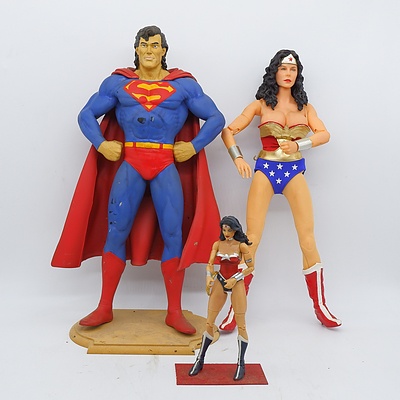 Superman and Two Wonder Woman Figures