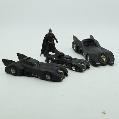Three Batman Vehicles and a Figurine, Including Hot Wheels and DC Comics