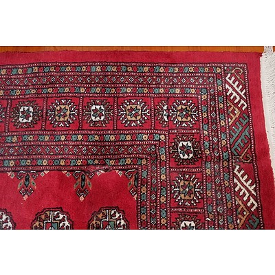 A Large Hand Knotted Wool Pile Bokhara Rug