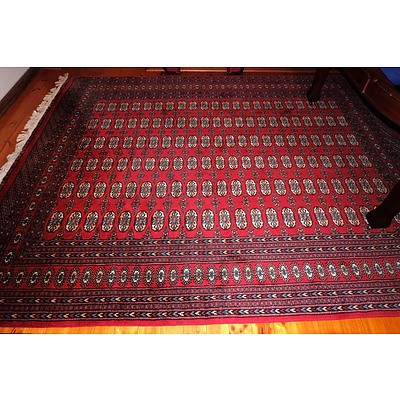 A Large Hand Knotted Wool Pile Bokhara Rug Similar To The Previous Lot