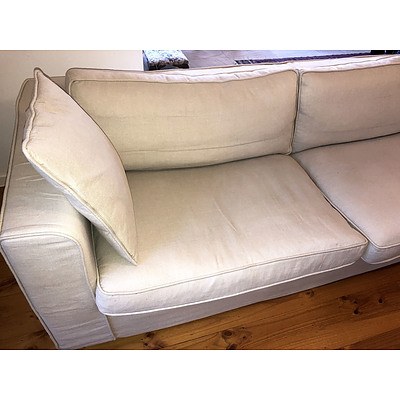 A Contemporary Linen Slip Covered Three Seater Sofa