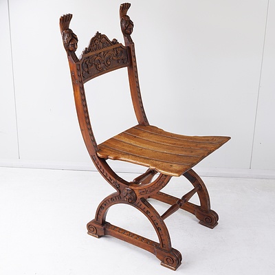 Campaign Chair with Scroll Work and Carved Head Finials
