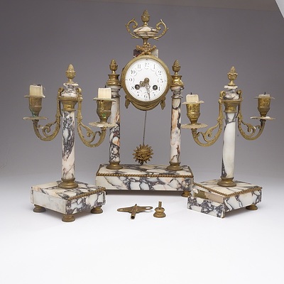 A French Empire Style Marble and Ormolu Clock Garniture, 4th Quarter of the 19th Century