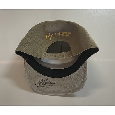 Tennis Racquet and Cap Autographed by Nick Kyrgios