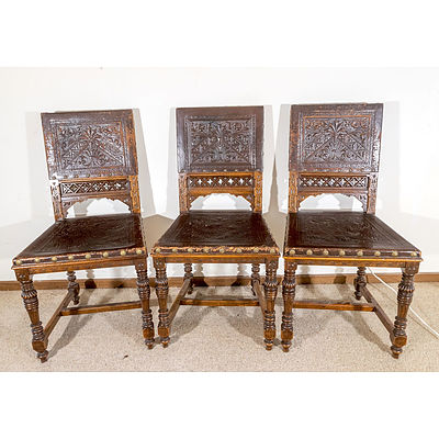 Six Late Victorian Walnut and Embossed Leather Dining Chairs with Tudor and Gothic Influence