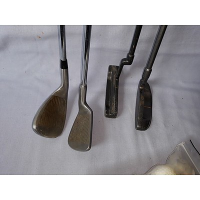 Golf putters & bag of used golf balls