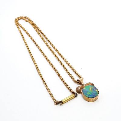 9ct Yellow Gold Pendant with Oval Opal Doublet in a Bezel Setting on a 9ct Gold Curb Chain, 5.4g