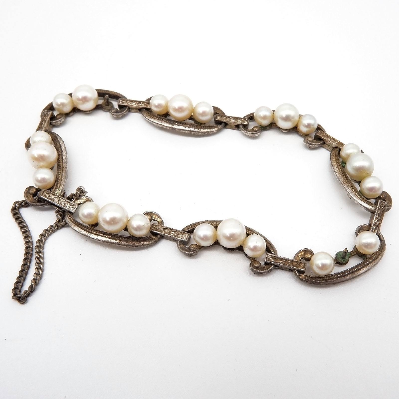 'Sterling Silver Mikimoto Bracelet, Eight Links Each with Three Round Creme White Cultured Pearls'