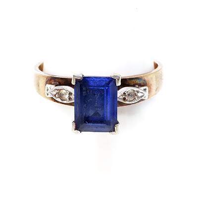 14ct Yellow and White Gold Ring with Banquette Cut Blue Sapphire, Raised Leaf Shoulders with Small Single Cut Diamond, 3.1g 
