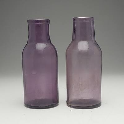 Two Vintage Amethyst Glass Bottles