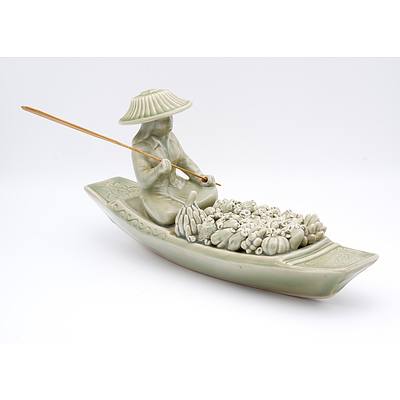 Thai Hand Modelled Celadon Glaze Stoneware Model of a Floating Market Vendor, 20th Century