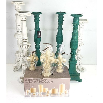 Six Large Candlesticks and a Group of Scented and Unscented Candles