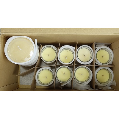 Six Large Candlesticks and a Group of Scented and Unscented Candles