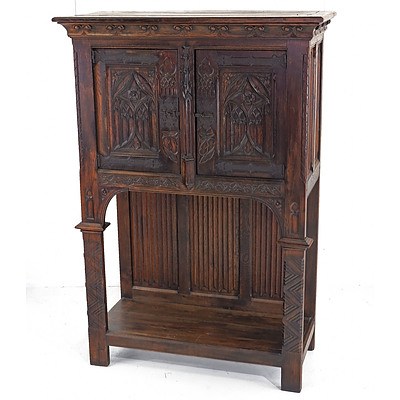 Good European Oak Arts and Crafts Oak Cabinet in the Gothic Revival Style with Hand Wrought Metal Hardware, Early 20th Century