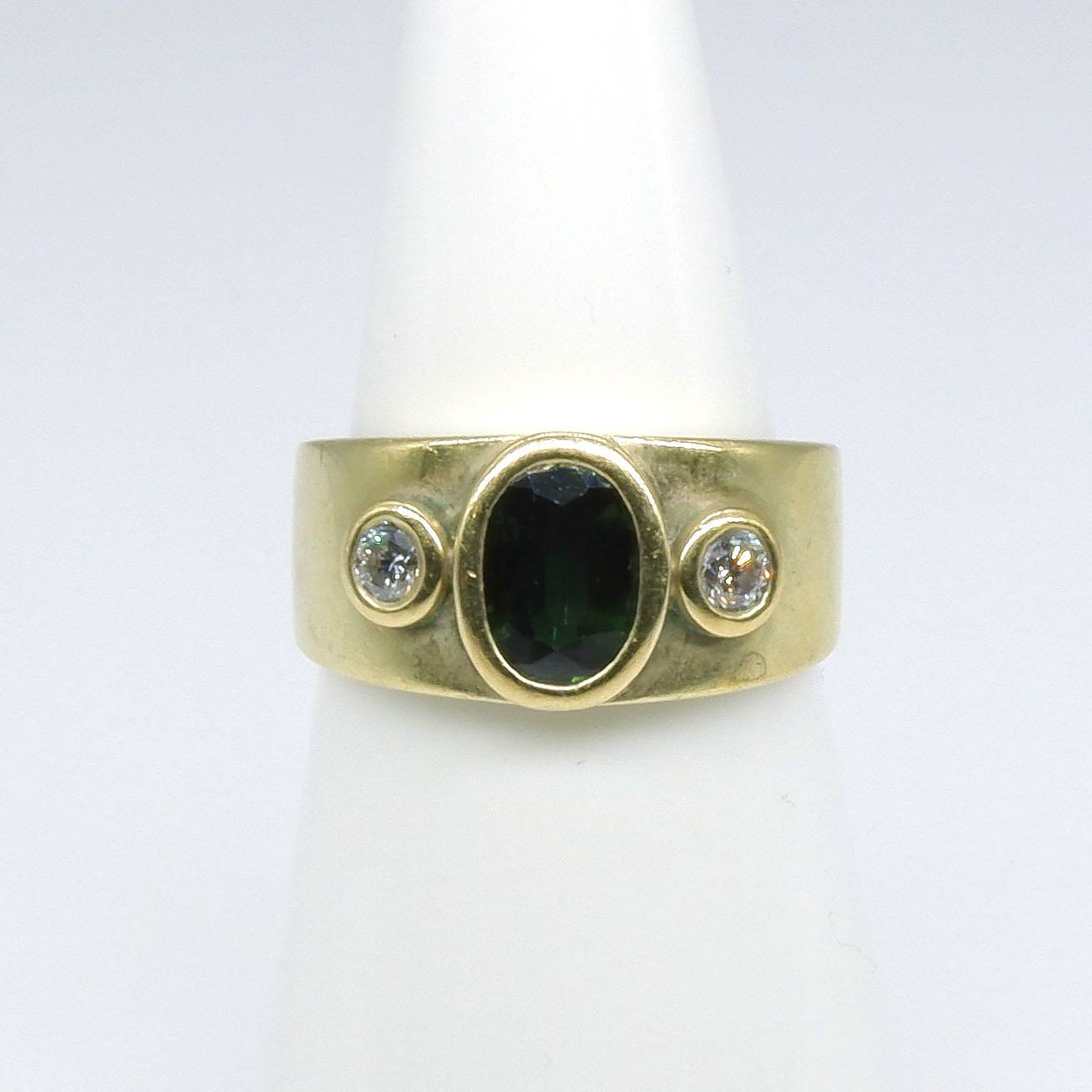 '18ct Yellow Gold Ring With Oval Facetted Green Sapphire on Either Side Round Brilliant Cut Diamonds'