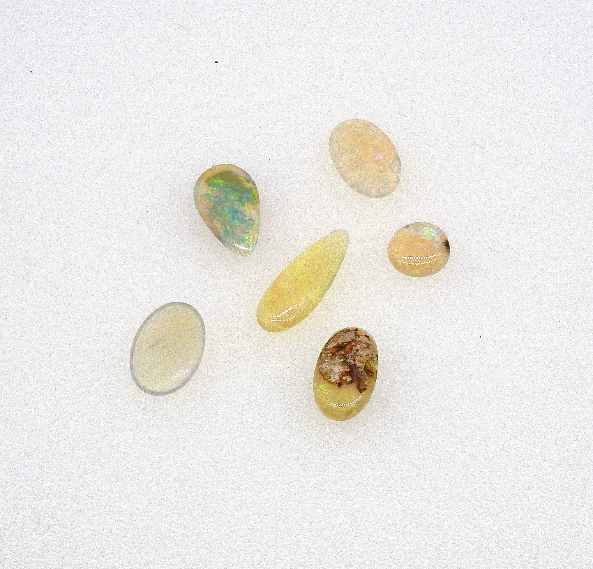 'Six Cabochons of Solid White Opal'