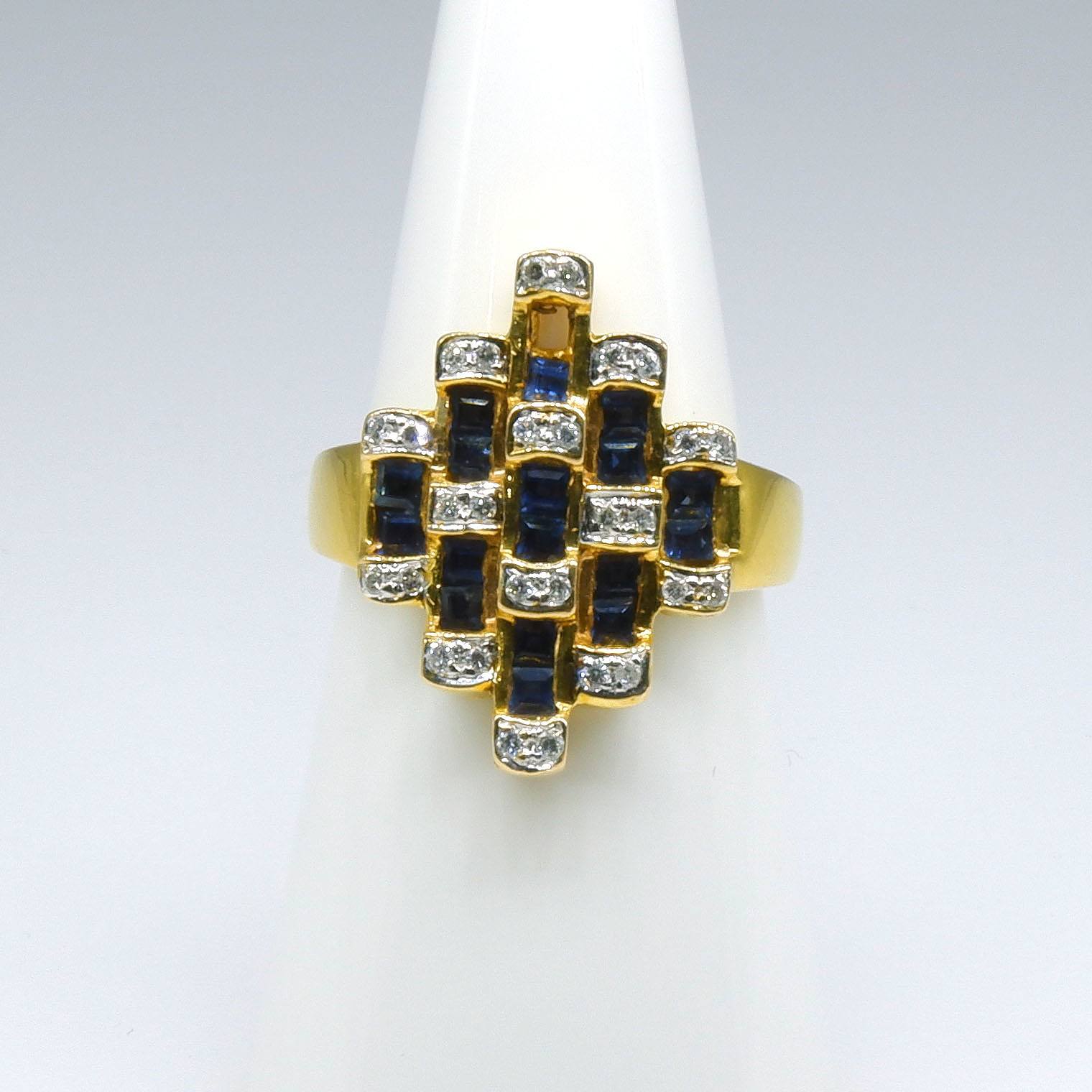 '18ct Yellow Gold Ring with Seventeen Carre Cut Sapphires and Twenty Eight Round Brilliant Cut Diamonds in Bars in Pairs'
