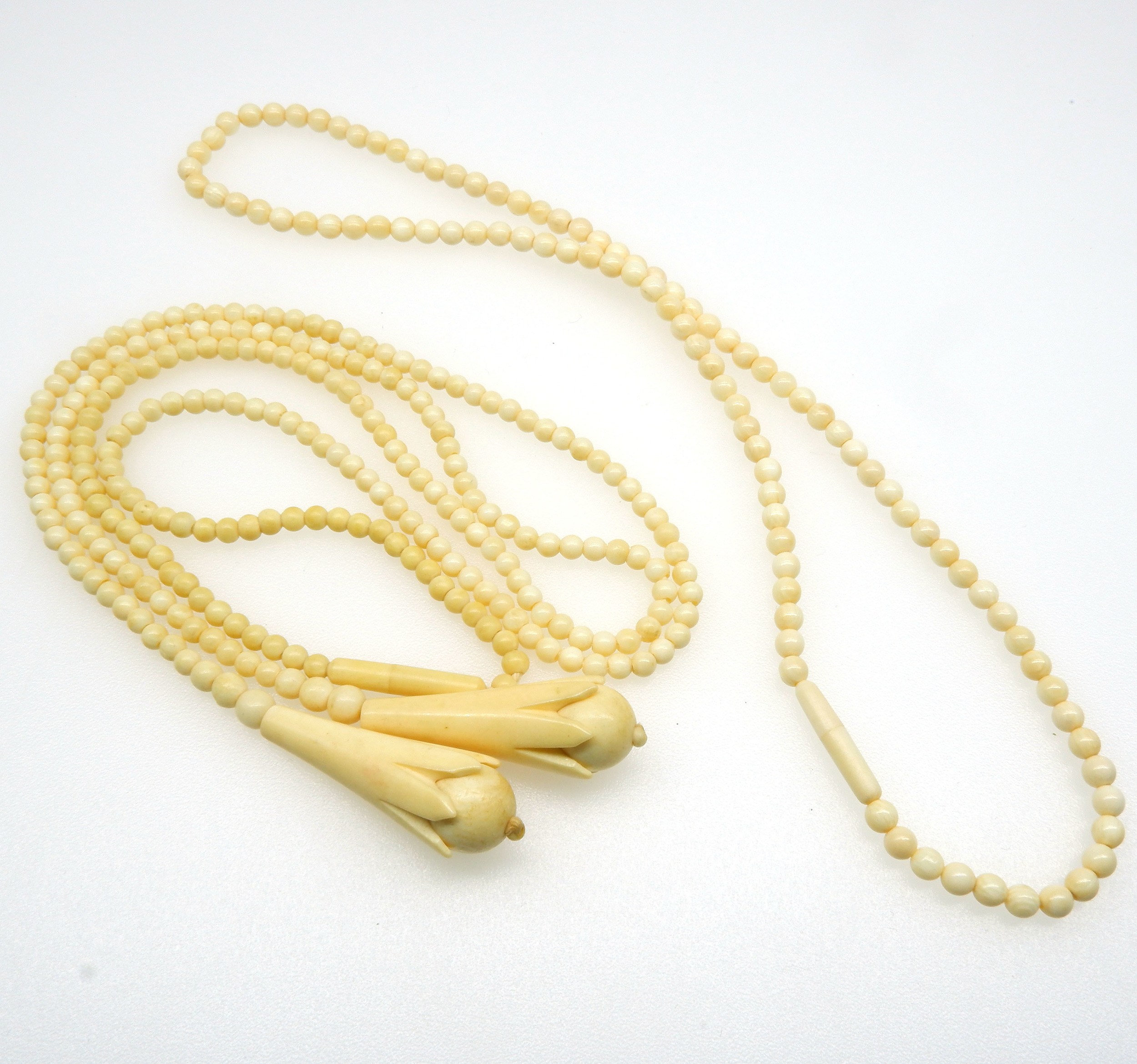 'Strand of 3.50mm Ivory Beads with Two Tear Drop Shaped Ends and a Strand of 4mm Ivory Beads'