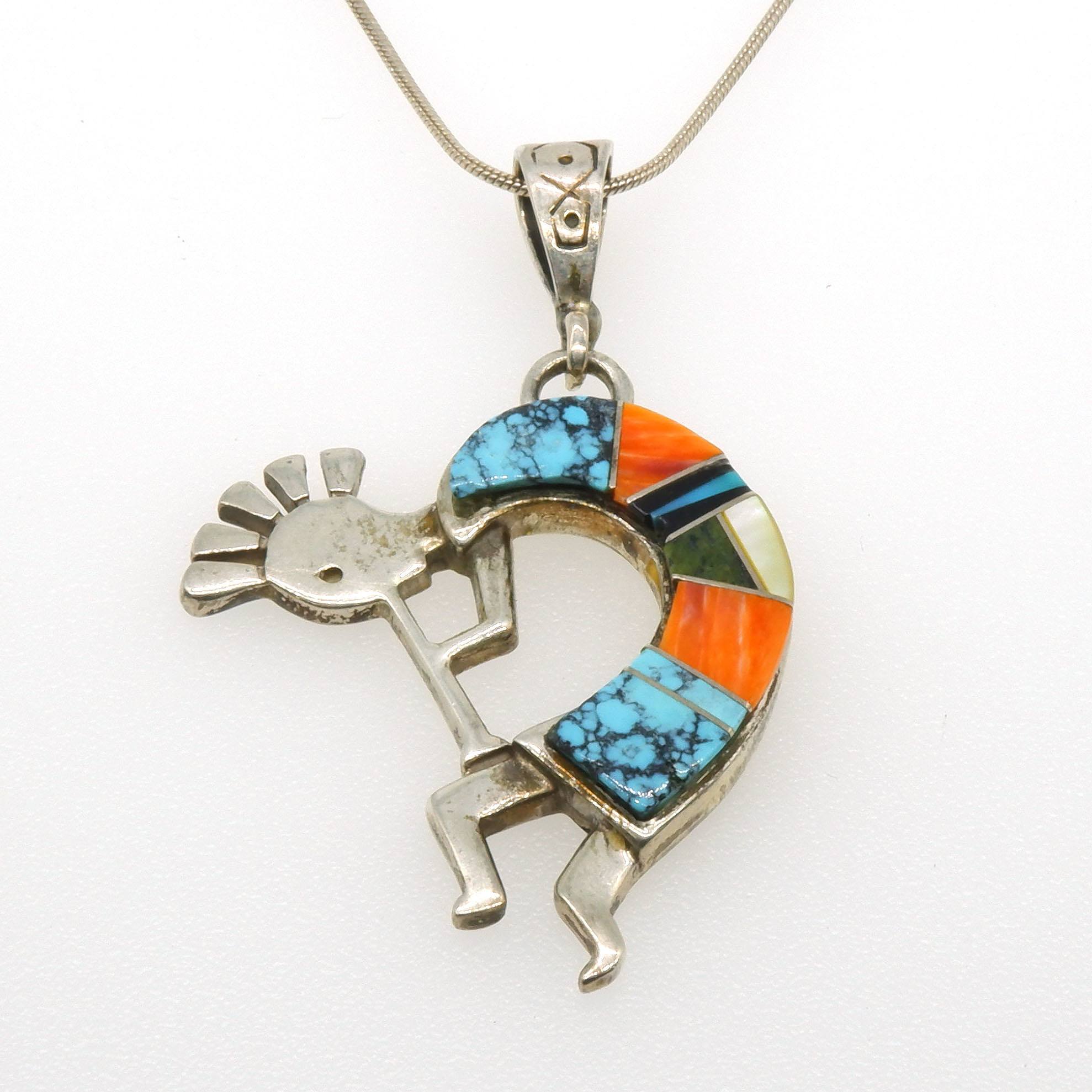 'Mexican Silver Figure Pendant with Mixed Gem Slabs, Including Turquoise and Jasper in a Curve'