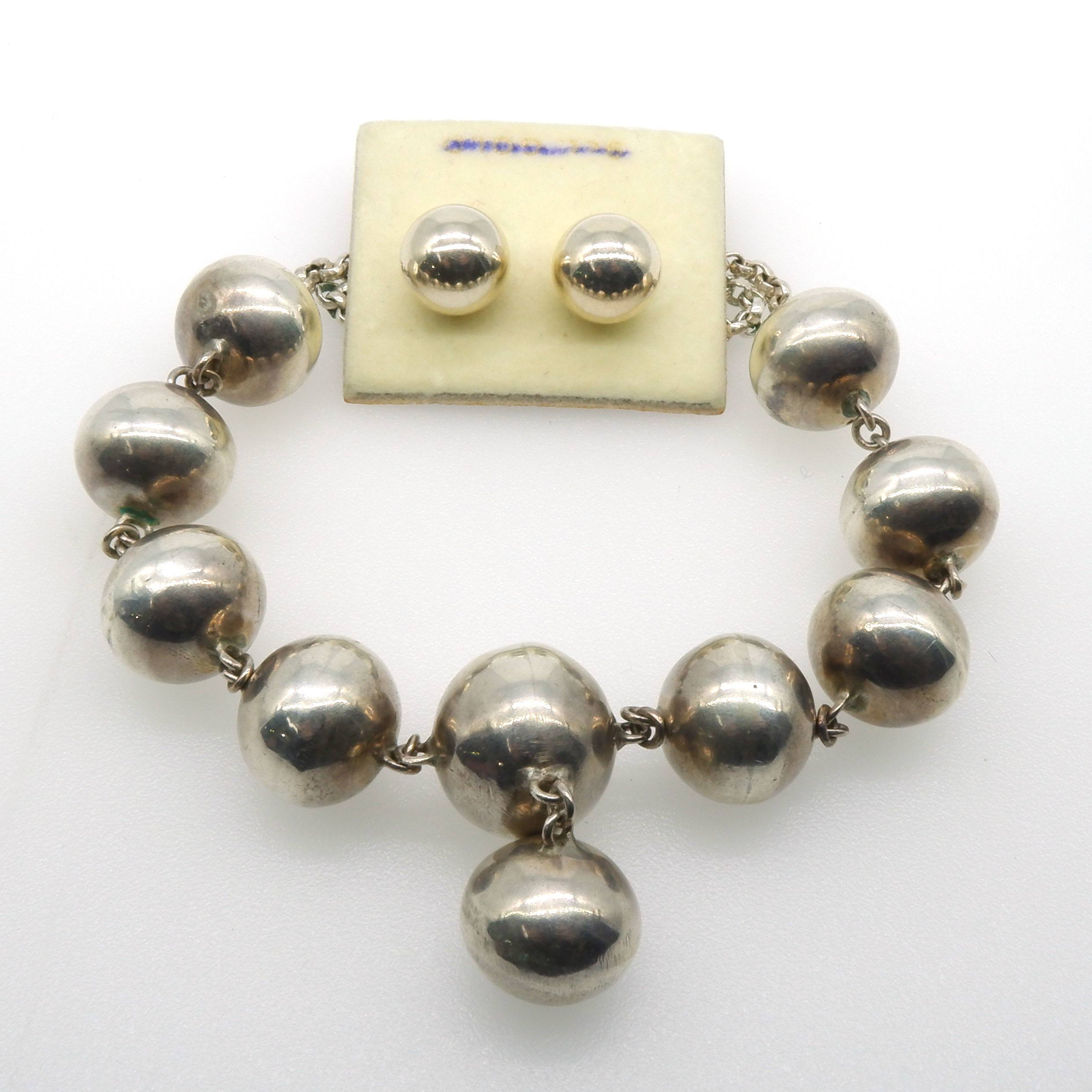'Handmade Silver Hollow Oval Balls Linked Together at the Centre of a Belcher Chain with Matching Earrings'