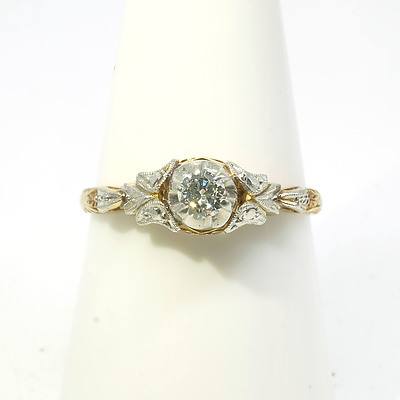 18ct Yellow and White Gold Diamond and Solitaire Ring, with Round Brilliant Cut Diamond in Six Claw Illusion Setting with Fancy Engraved Shoulders, 2.5g