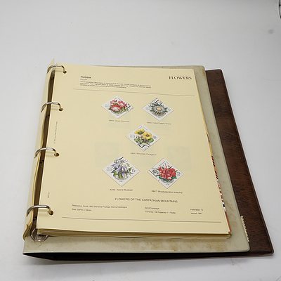 Two Stamp Albums with a large Group of International Stamps, Including Paraguay, Mongolia, Romania, Central African Republic and More