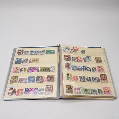 Four Stamp Albums with Various Australian and International Stamps, Including Australian King George V 2d Red, Colombo Plan 1951, Montreal 1976 Olympics and More