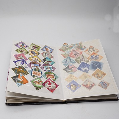 Four Stamp Albums with Various Australian and International Stamps, Australian First Day Covers, and Australia Post Stamp Sets