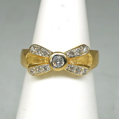 18ct Yellow Gold Diamond 'Bow' Ring with at Centre 0.08ct Round Brilliant Cut Diamond in Bezel Setting and Twelve 0.01ct Diamonds in Pave Setting