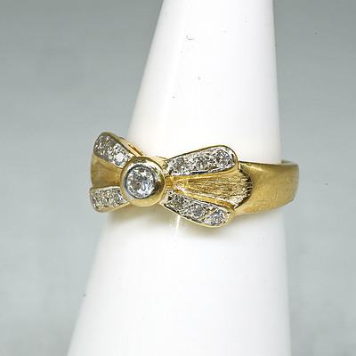 18ct Yellow Gold Diamond 'Bow' Ring with at Centre 0.08ct Round Brilliant Cut Diamond in Bezel Setting and Twelve 0.01ct Diamonds in Pave Setting