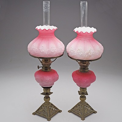 Pair of Small Late Victorian Oil Lamps with Moulded Cased Pink Glass Fonts and Shades