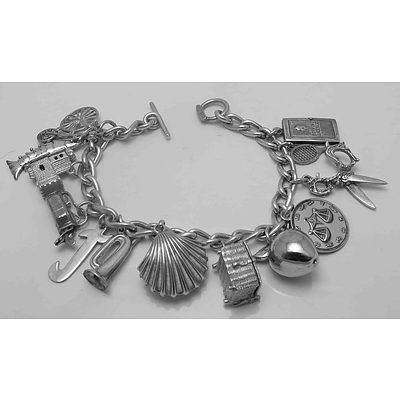 Sterling Silver Charm Bracelet With Assorted Interesting Charms