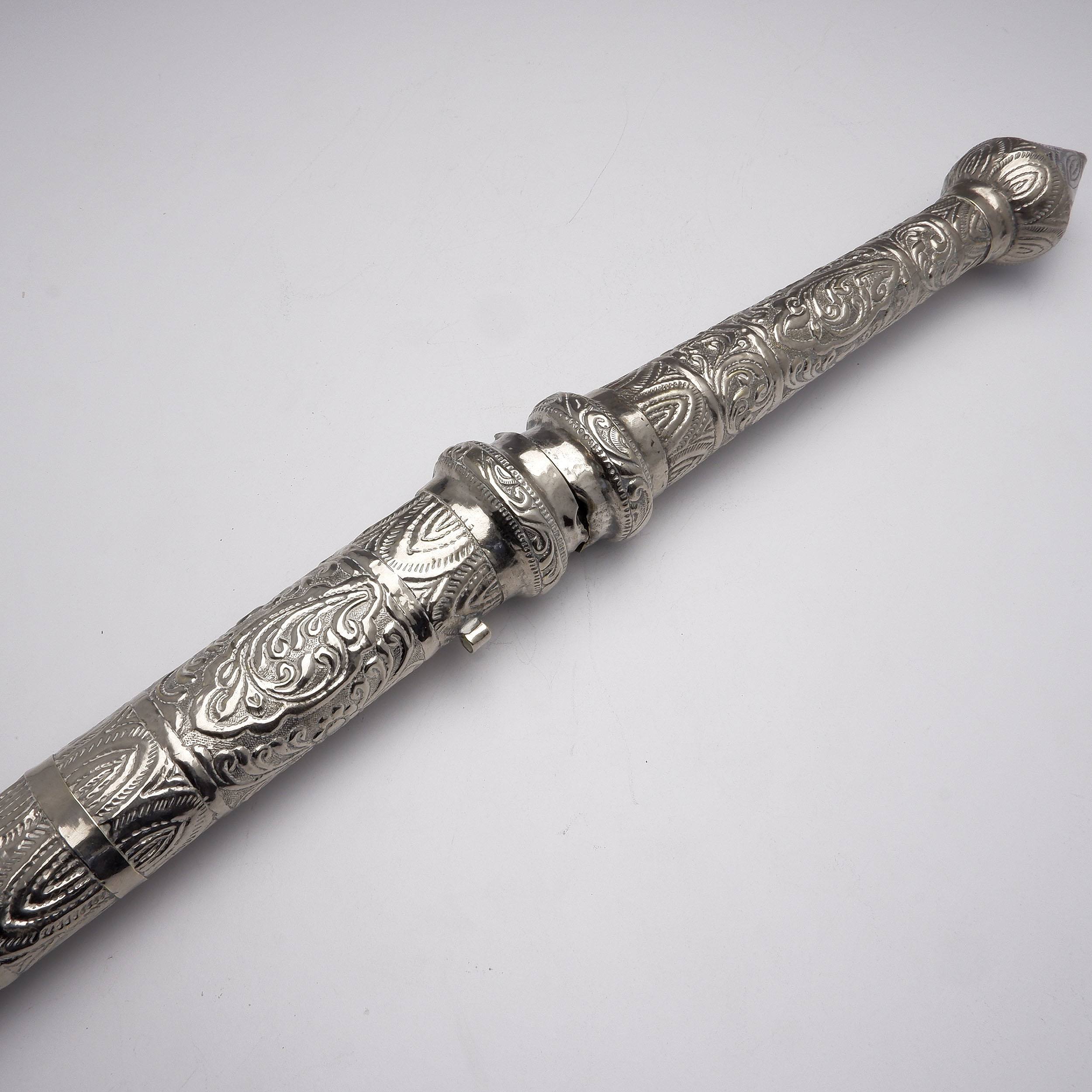 'Burmese Silver Cased Sword, Profusely Repousse Decoration'