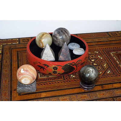 Various Polished Stone Spheres and Pyramids and an Asian Lacquer Bowl