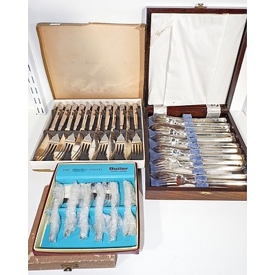 Three Boxed Sets of Six Fish Servers and Two Boxed Sets of Teaspoons