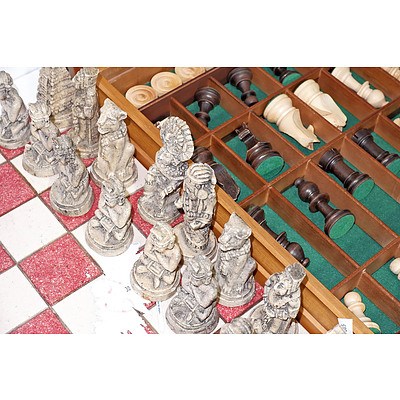 Carved Wood Chess Set and Another Cast Resin Aztec Theme Chess Set