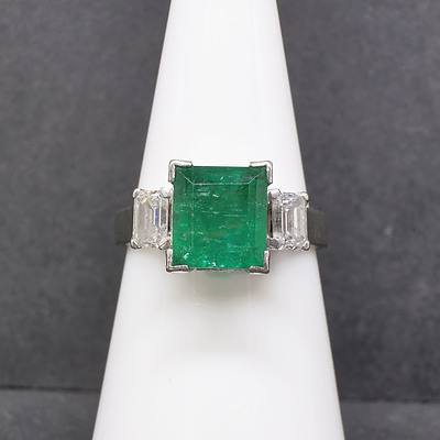 18ct White Gold Ring With 2.42ct Bright Dark Green Emerald with Two Emerald Cut Diamonds