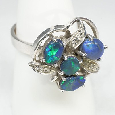 18ct White Gold and Platinum Ring With Four Cabochons of Black Opal and Eight Single Cut Diamonds