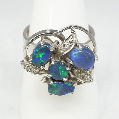 18ct White Gold and Platinum Ring With Four Cabochons of Black Opal and Eight Single Cut Diamonds
